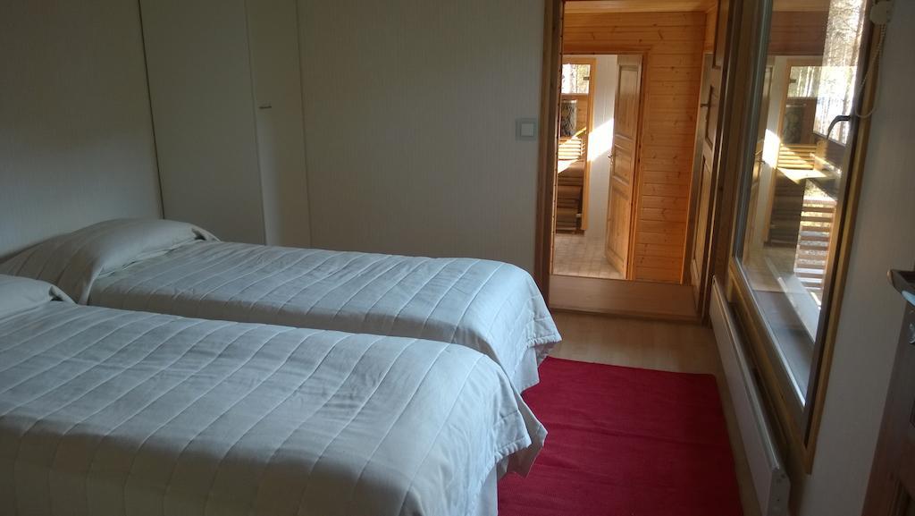 Kuoreksenniemi Villas & Lakehouse Puumala Pokoj fotografie