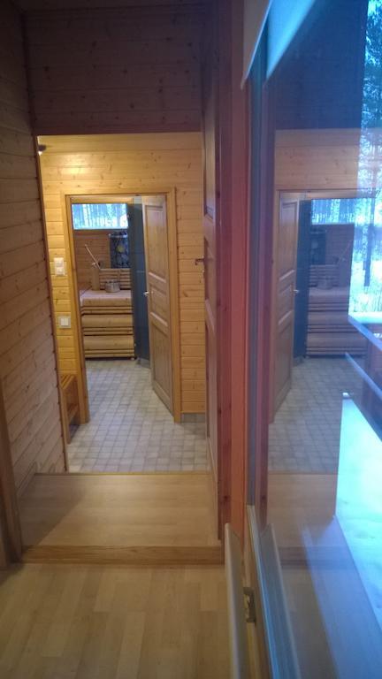 Kuoreksenniemi Villas & Lakehouse Puumala Pokoj fotografie